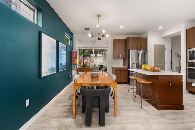5202 Rob Scott St, Austin, TX 78721 - dining area with recessed lighting and a chandelier
