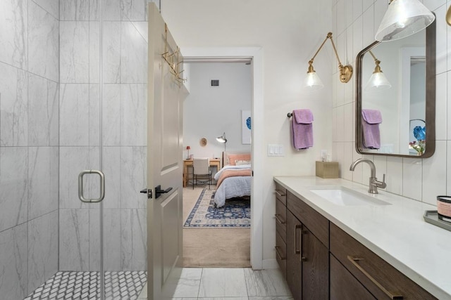 5202 Rob Scott St, Austin, TX 78721 - full bathroom featuring vanity, marble look tiles, a shower stall, and connected bathroom