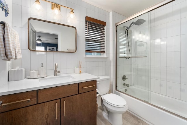 5202 Rob Scott St, Austin, TX 78721 - full bath with vanity, tile walls, combined bath / shower with glass door, and ceiling fan