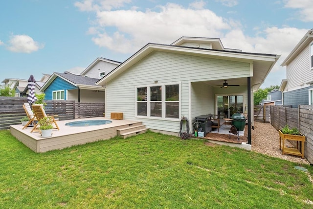 5202 Rob Scott St, Austin, TX 78721 - rear view of house featuring a jacuzzi, a ceiling fan, a fenced backyard, and a patio