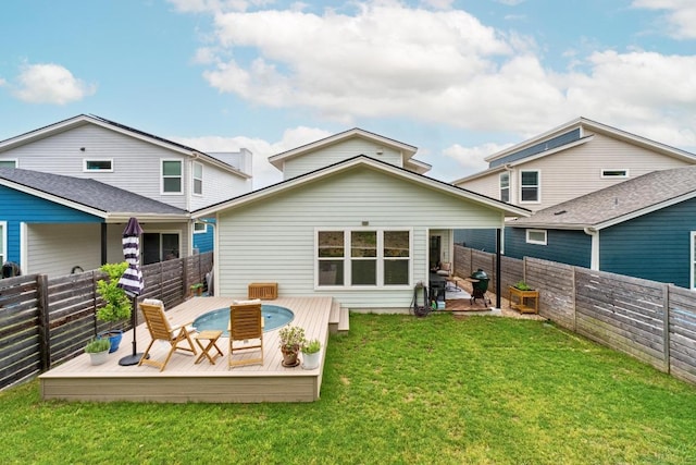 5202 Rob Scott St, Austin, TX 78721 - back of house featuring a fenced backyard and a wooden deck