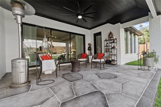 view of patio featuring ceiling fan