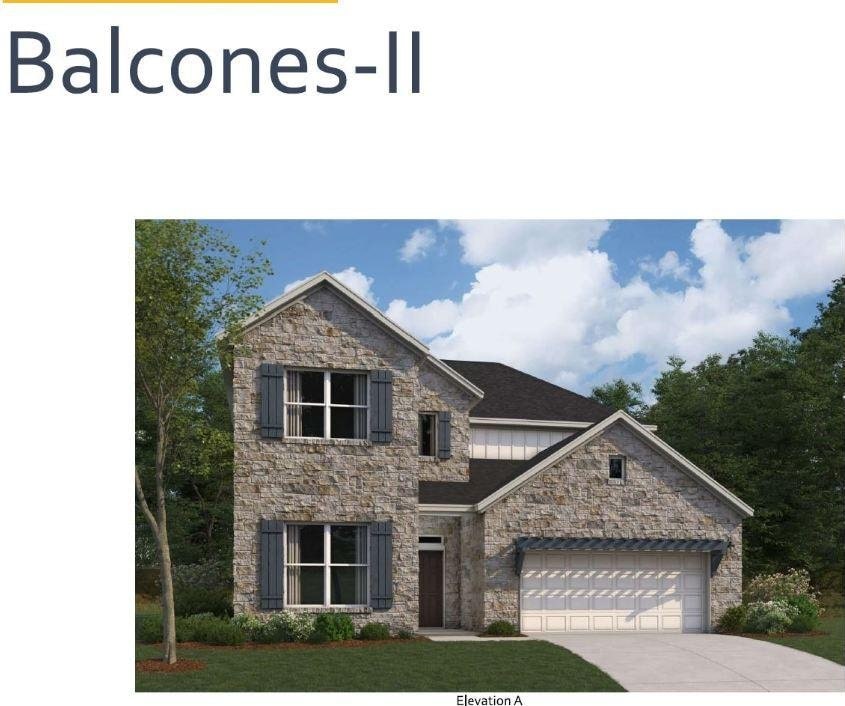 view of front of property with stone siding, driveway, and a garage
