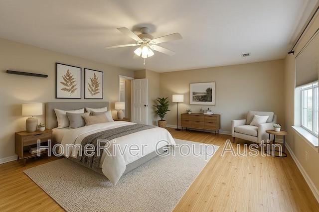 1481 Newbury St, Georgetown, TX 78626 - bedroom with wood finished floors, a ceiling fan, and baseboards