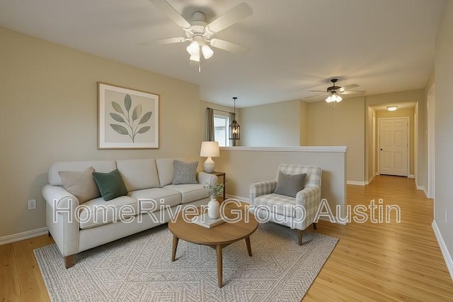 1481 Newbury St, Georgetown, TX 78626 - living room featuring ceiling fan, light wood-style floors, and baseboards