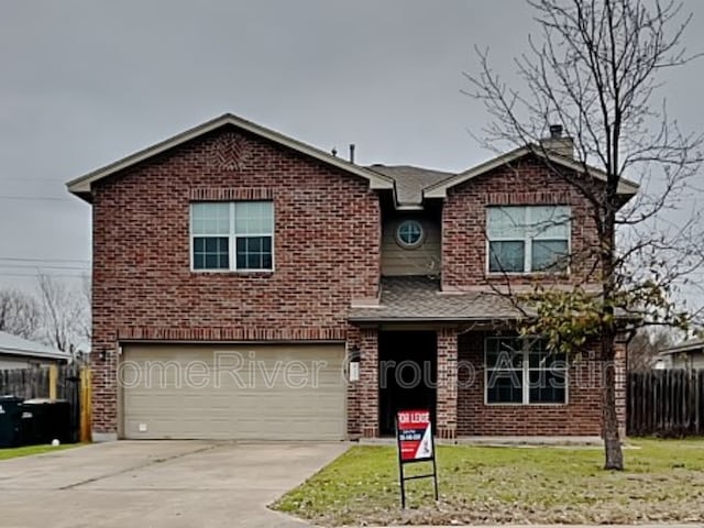 1481 Newbury St, Georgetown, TX 78626 - traditional home with a garage, fence, concrete driveway, brick siding, and a chimney