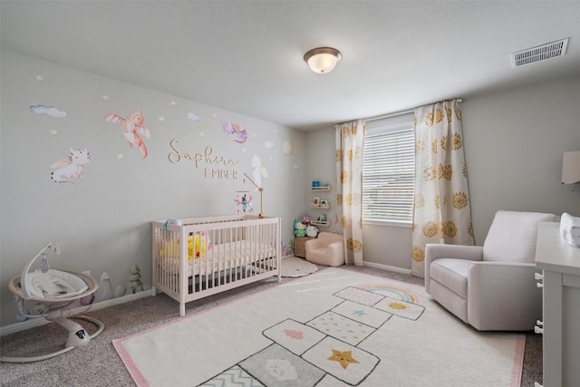 503 Windy Reed Rd, Hutto, TX 78634 - carpeted bedroom with a nursery area and baseboards