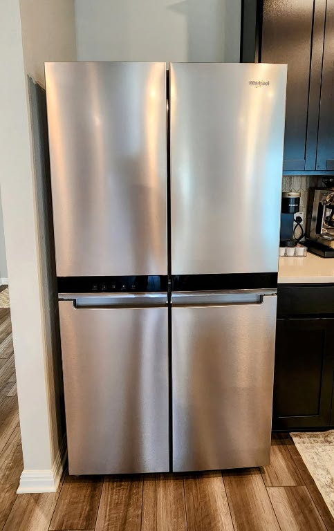 503 Windy Reed Rd, Hutto, TX 78634 - kitchen view of freestanding refrigerator, light wood finished floors, and light countertops