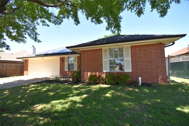 2803 Mason Dr, Killeen, TX 76549 - single story home with brick siding, concrete driveway, solar panels, a garage, and a chimney