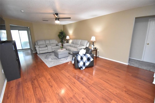 2803 Mason Dr, Killeen, TX 76549 - living room featuring a ceiling fan, wood finished floors, and baseboards