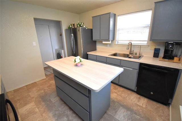 2803 Mason Dr, Killeen, TX 76549 - kitchen featuring dishwasher, a sink, gray cabinets, freestanding refrigerator, and a kitchen island