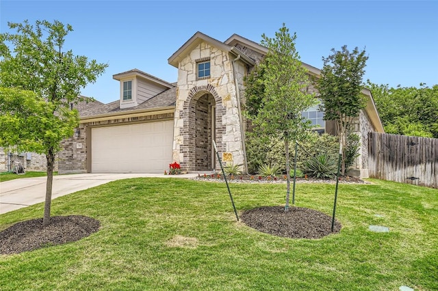 552 Windom Way, Georgetown, TX 78626 - view of front of home with driveway, stone siding, an attached garage, brick siding, and a shingled roof