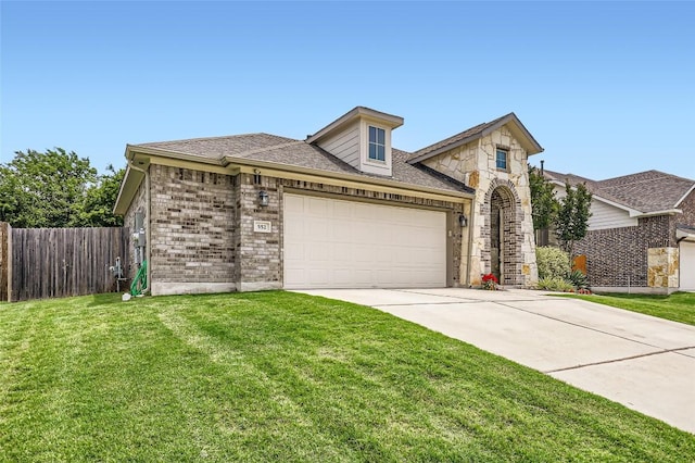 552 Windom Way, Georgetown, TX 78626 - view of front of property featuring concrete driveway, a garage, and brick siding