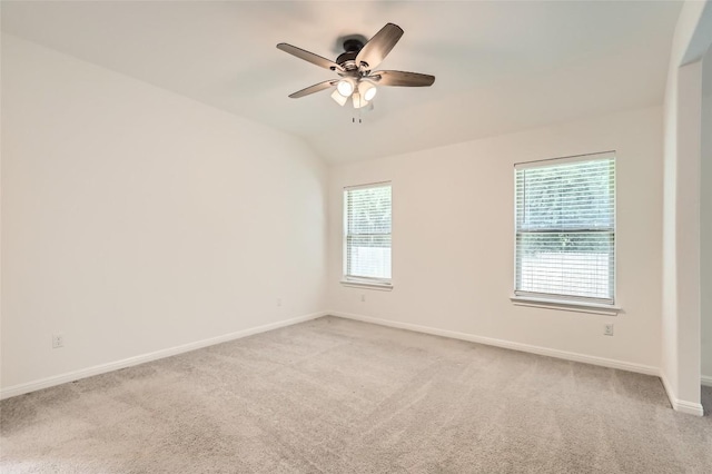552 Windom Way, Georgetown, TX 78626 - empty room featuring light carpet, baseboards, ceiling fan, and vaulted ceiling