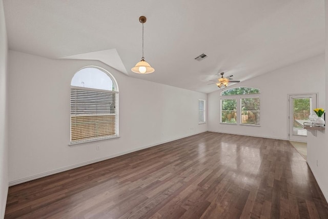 unfurnished living room with vaulted ceiling, wood finished floors, a ceiling fan, and baseboards