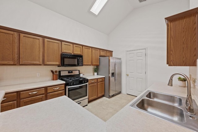 kitchen with stainless steel appliances, a sink, brown cabinetry, high vaulted ceiling, and light countertops