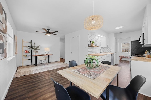 5916 Signal Pt, Austin, TX 78724 - dining room with wood finished floors and ceiling fan