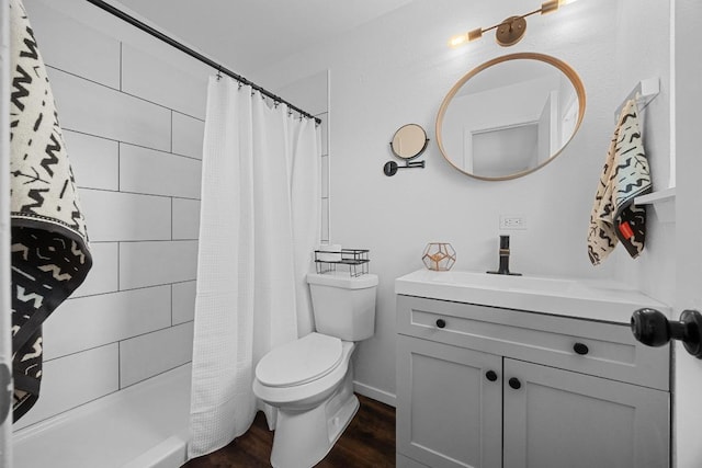 5916 Signal Pt, Austin, TX 78724 - bathroom featuring toilet, wood finished floors, tiled shower, and vanity