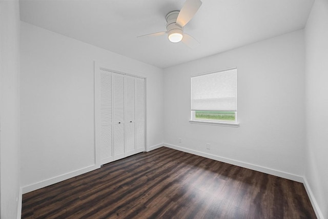 5916 Signal Pt, Austin, TX 78724 - unfurnished bedroom featuring dark wood finished floors, a closet, baseboards, and ceiling fan