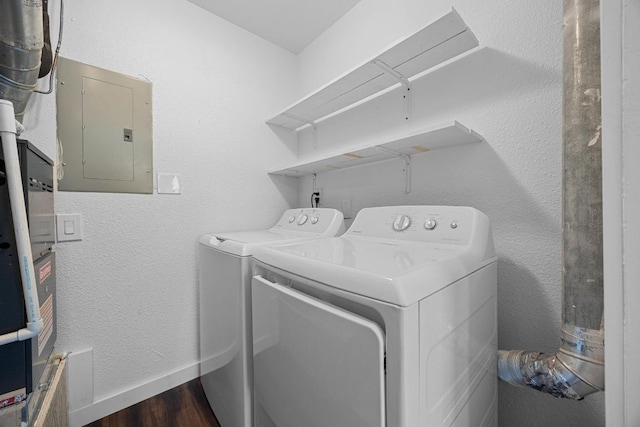 5916 Signal Pt, Austin, TX 78724 - laundry area featuring electric panel, washer and clothes dryer, and dark wood-style flooring
