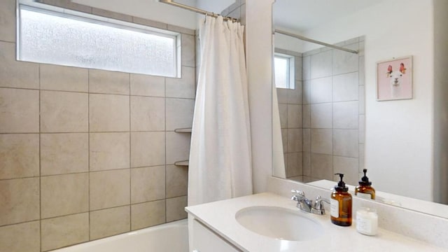 221 Mendoza, Kyle, TX 78640 - bathroom featuring vanity and shower / tub combo with curtain