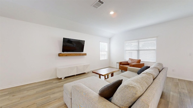 221 Mendoza, Kyle, TX 78640 - living area with light wood-style floors, baseboards, vaulted ceiling, and recessed lighting