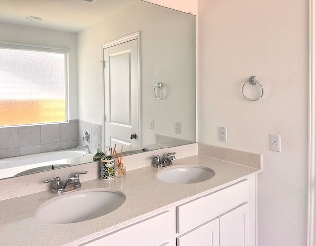 221 Mendoza, Kyle, TX 78640 - full bathroom featuring double vanity and a bath
