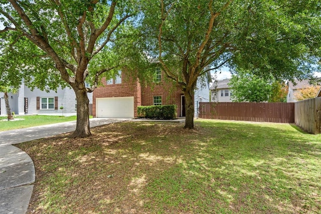 361 Whispering Hollow Dr, Kyle, TX 78640 - view of front of home featuring a garage, concrete driveway, and brick siding