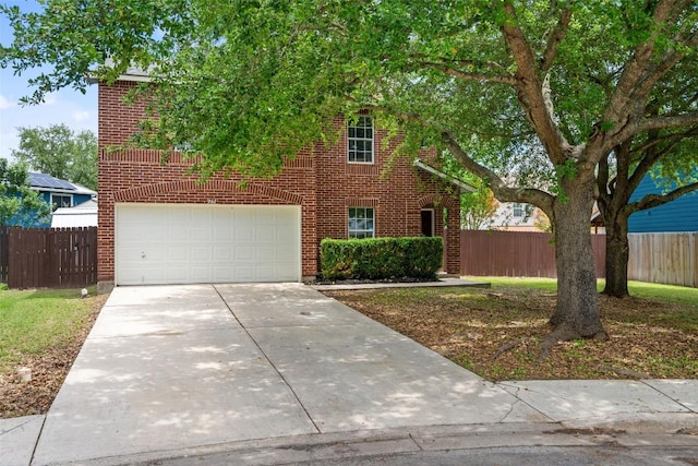 361 Whispering Hollow Dr, Kyle, TX 78640 - view of front facade featuring concrete driveway, a garage, and fence