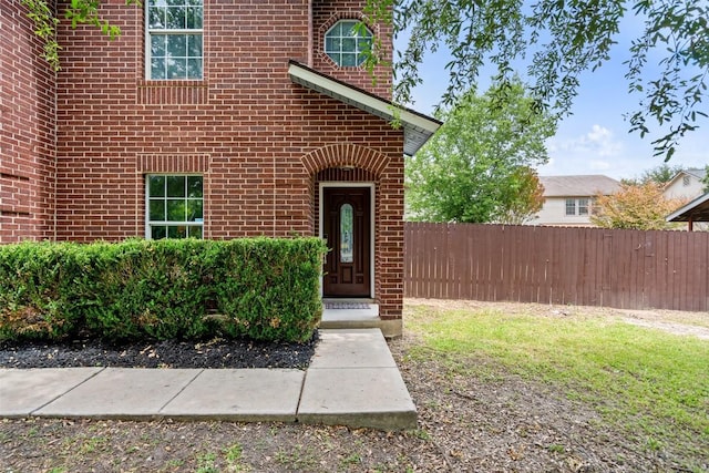 361 Whispering Hollow Dr, Kyle, TX 78640 - view of exterior entry featuring fence and brick siding
