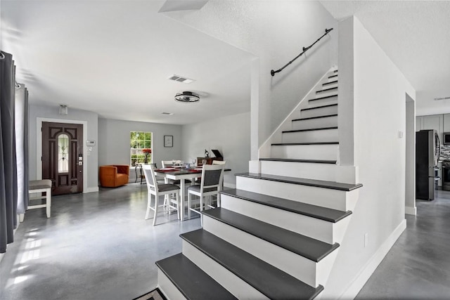 361 Whispering Hollow Dr, Kyle, TX 78640 - stairs featuring finished concrete flooring and baseboards