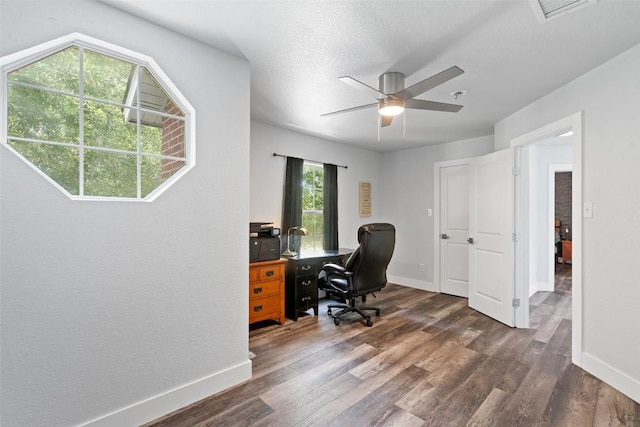 361 Whispering Hollow Dr, Kyle, TX 78640 - home office featuring ceiling fan, dark wood-type flooring, and baseboards