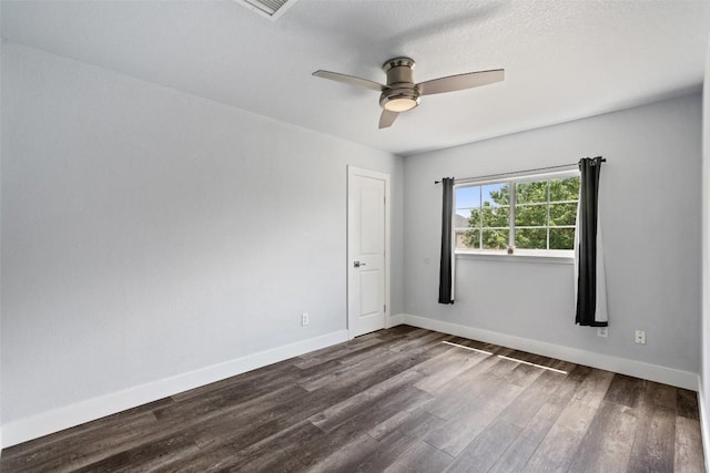 361 Whispering Hollow Dr, Kyle, TX 78640 - unfurnished room featuring dark wood-style floors, a ceiling fan, and baseboards