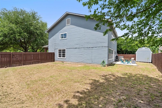 361 Whispering Hollow Dr, Kyle, TX 78640 - view of home's exterior featuring a shed, a patio, and an outdoor structure