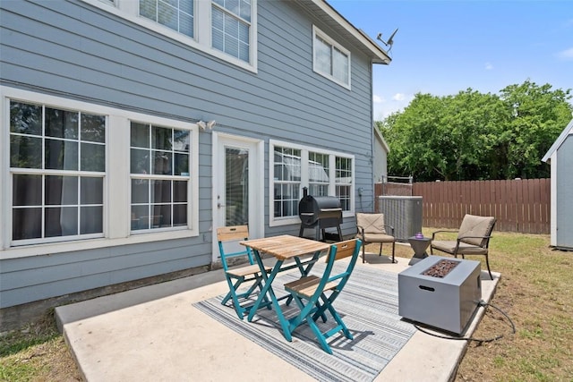 361 Whispering Hollow Dr, Kyle, TX 78640 - view of patio featuring a fire pit, fence, and area for grilling