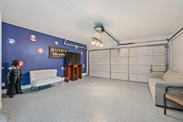 361 Whispering Hollow Dr, Kyle, TX 78640 - garage with a textured wall, baseboards, and a garage door opener