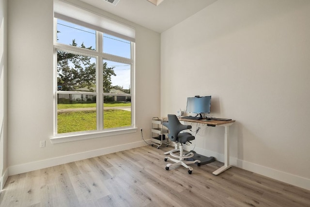 20704 Leaning Oak Dr, Lago Vista, TX 78645 - office featuring healthy amount of natural light and wood finished floors