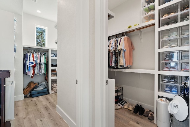 20704 Leaning Oak Dr, Lago Vista, TX 78645 - walk in closet featuring wood finished floors
