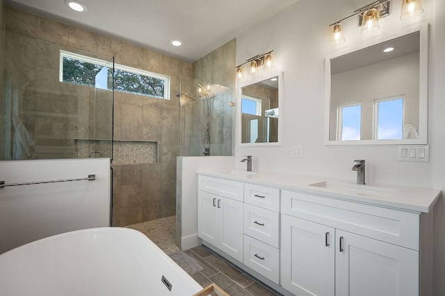 20704 Leaning Oak Dr, Lago Vista, TX 78645 - full bathroom featuring a freestanding bath, double vanity, a walk in shower, and recessed lighting