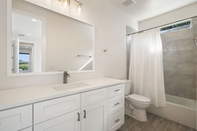 20704 Leaning Oak Dr, Lago Vista, TX 78645 - bathroom featuring vanity, shower / tub combo with curtain, and wood tiled floors