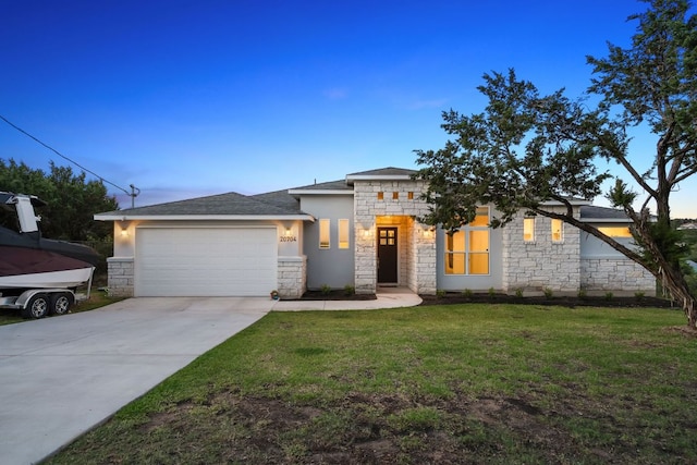 20704 Leaning Oak Dr, Lago Vista, TX 78645 - view of front facade with stone siding, a garage, driveway, and a yard