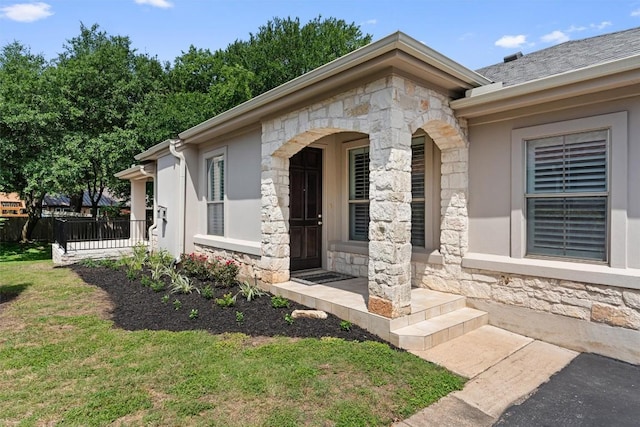 11558 Spicewood Pkwy Unit 7, Austin, TX 78750 - view of exterior entry with stone siding and covered porch