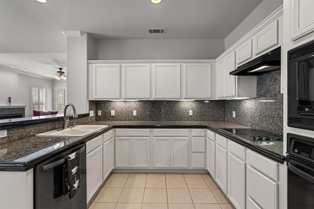 11558 Spicewood Pkwy Unit 7, Austin, TX 78750 - kitchen with a sink, black appliances, under cabinet range hood, white cabinetry, and recessed lighting