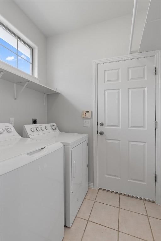 11558 Spicewood Pkwy Unit 7, Austin, TX 78750 - clothes washing area with separate washer and dryer and light tile patterned flooring