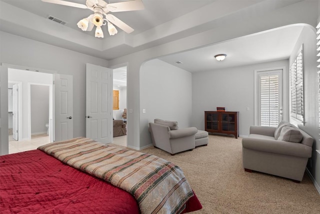 11558 Spicewood Pkwy Unit 7, Austin, TX 78750 - bedroom featuring baseboards, a tray ceiling, and light colored carpet