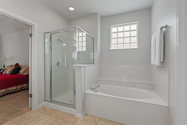 11558 Spicewood Pkwy Unit 7, Austin, TX 78750 - bathroom with tile patterned flooring, a bath, a shower stall, and ensuite bathroom