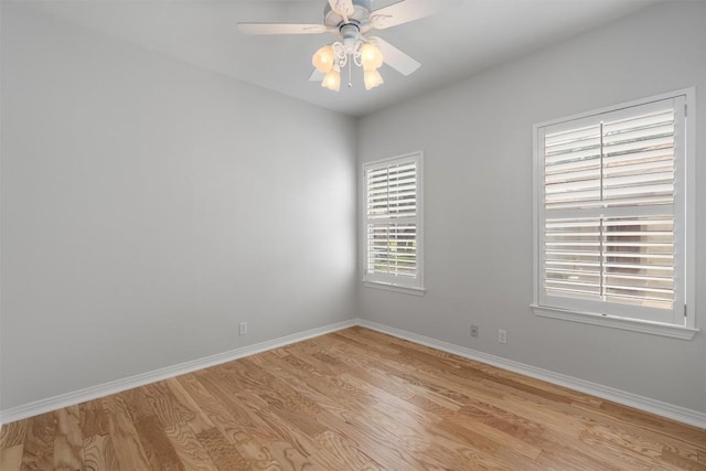 11558 Spicewood Pkwy Unit 7, Austin, TX 78750 - spare room with light wood finished floors, baseboards, and a ceiling fan
