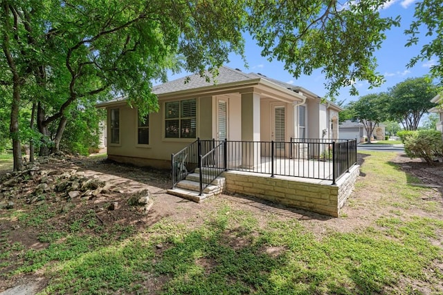 11558 Spicewood Pkwy Unit 7, Austin, TX 78750 - view of front facade with stucco siding and roof with shingles