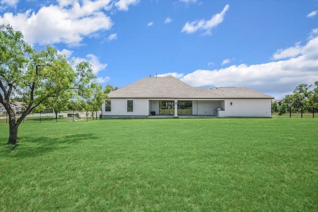 rear view of house with stucco siding