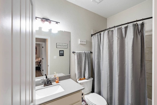 512 Bell Boot Pass, Georgetown, TX 78626 - full bath with vanity, toilet, and a textured wall